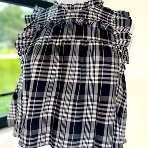 Ladies Large Black and white plaid shirt sleeve blouse with cap sleeves.